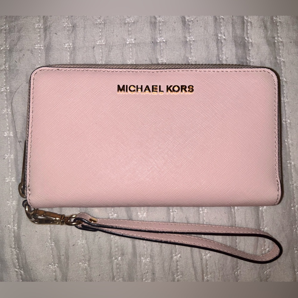 Medium size Michael Kors wallet with wrist band.